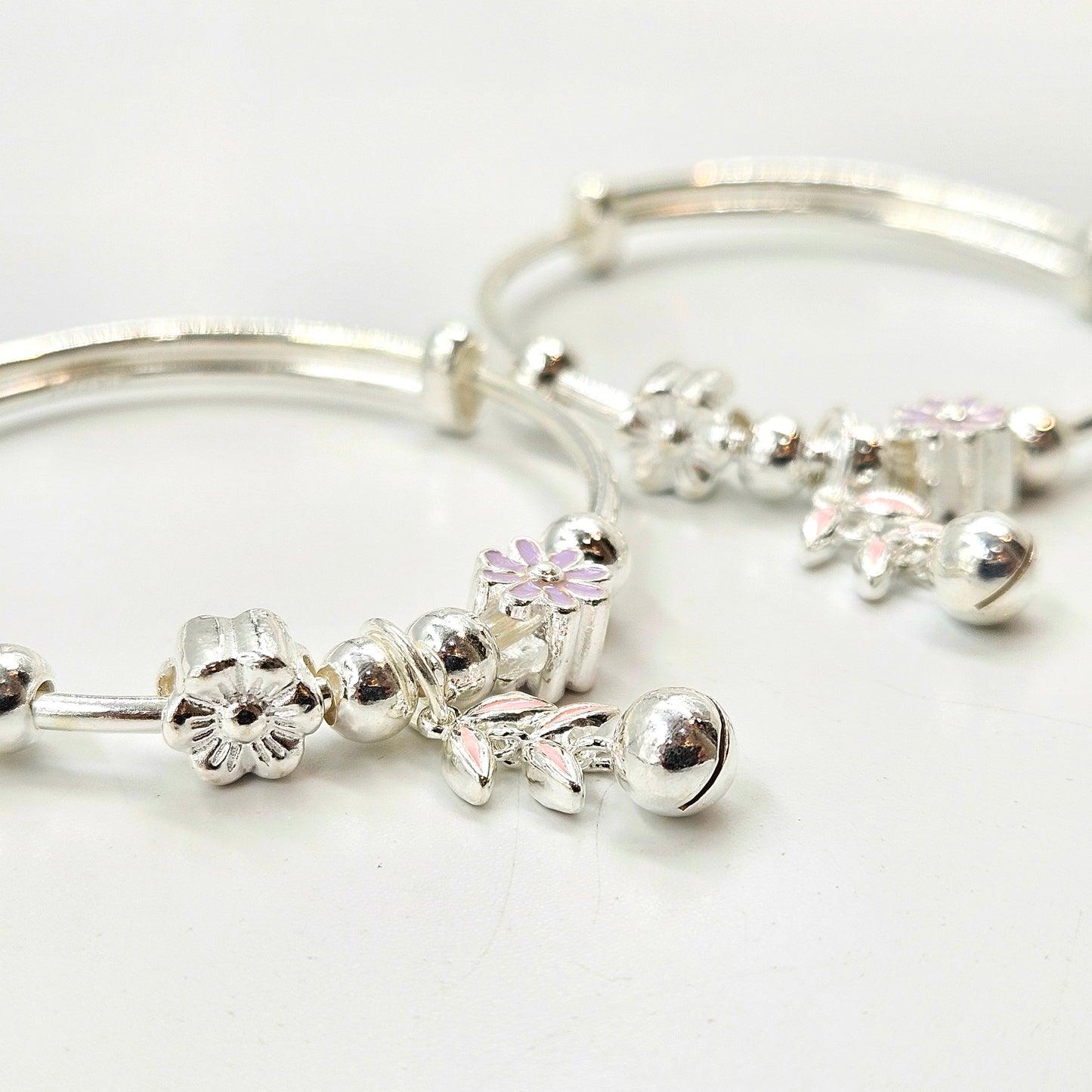 Silver Baby Bangles with Floral Charms and Jingle Bell
