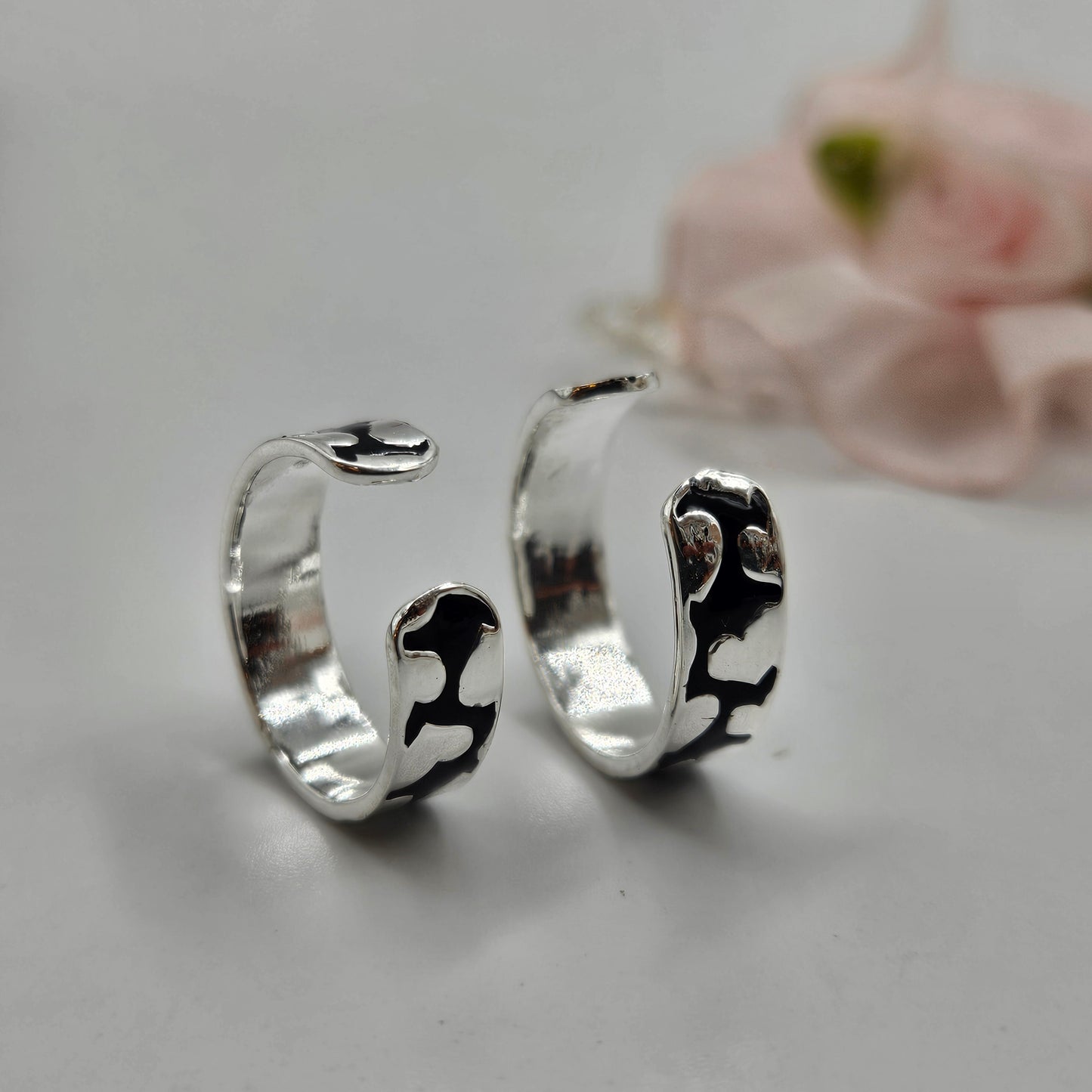 Sterling silver toe rings with a black abstract pattern