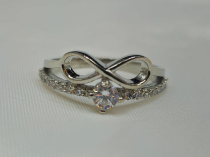 Silver layered infinity and pave chevron ring