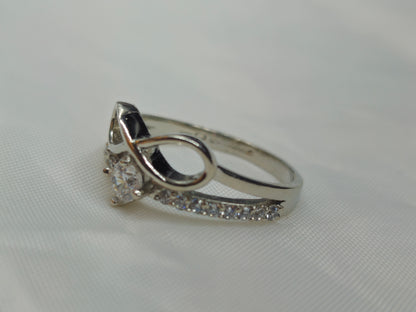 Silver layered infinity and pave chevron ring
