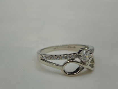Silver layered infinity and pave chevron ring