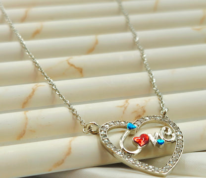 Silver Pave Heart Pendant with Enamel "Love" Script.