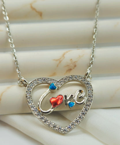 Silver Pave Heart Pendant with Enamel "Love" Script.