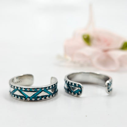 A turquoise tribal pattern toe rings