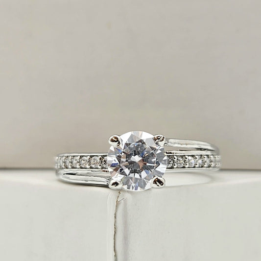 Round-Cut Solitaire Engagement Ring with a Channel-Set Band