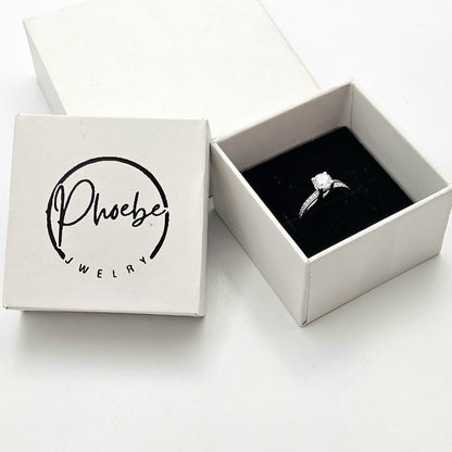 Round-Cut Solitaire Engagement Ring with a Channel-Set Band