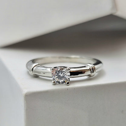Solitaire Ring With A Distinctive Wrapped Shoulder Design